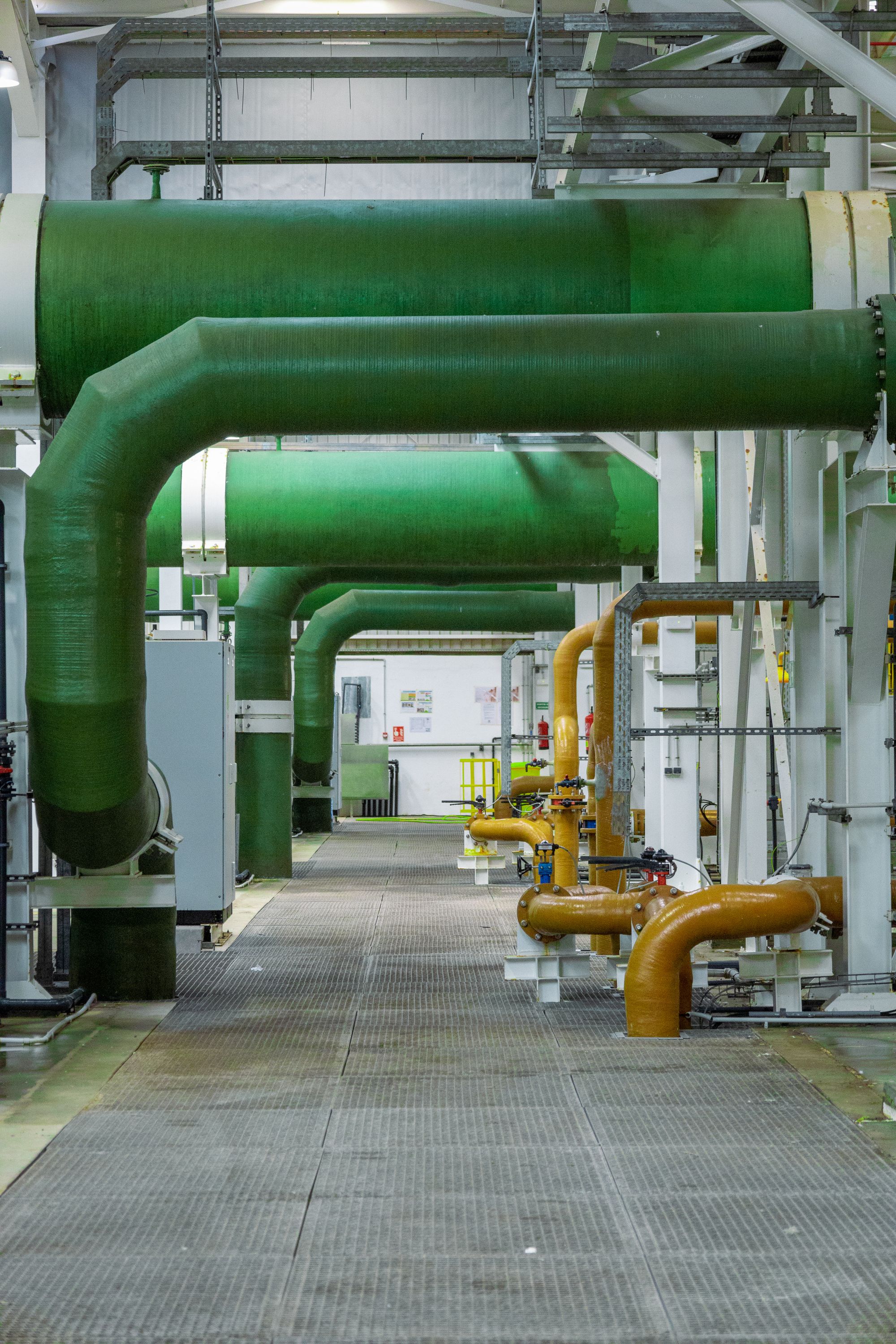 Industrial piping inside a modern operating facility